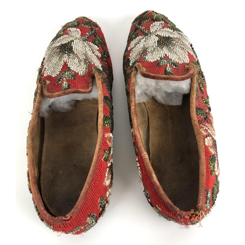 824 - A pair of late 19th/early 20th century beadwork slippers, decorated flowers