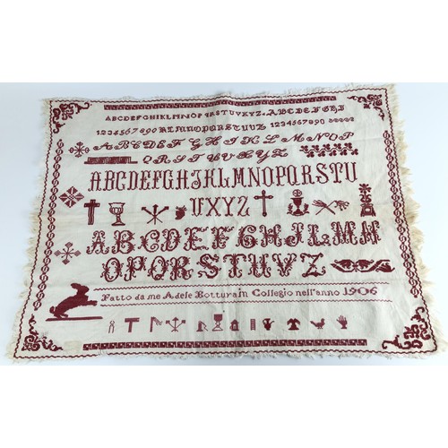 828 - An early 20th century sampler, signed Adele Botturain, dated 1906, 39 x 57 cm