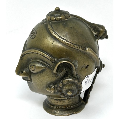 921 - An African style bronze head, 11 cm high