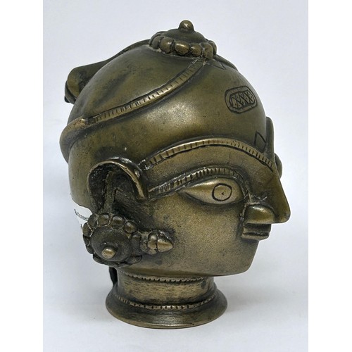 921 - An African style bronze head, 11 cm high