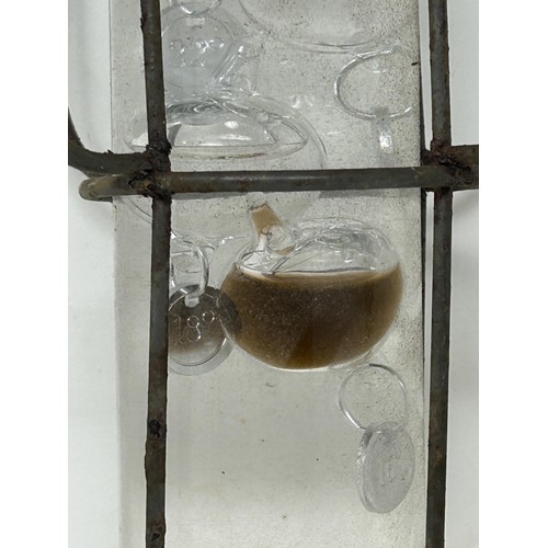 923 - An unusual glass and metal thermometer, 45 cm