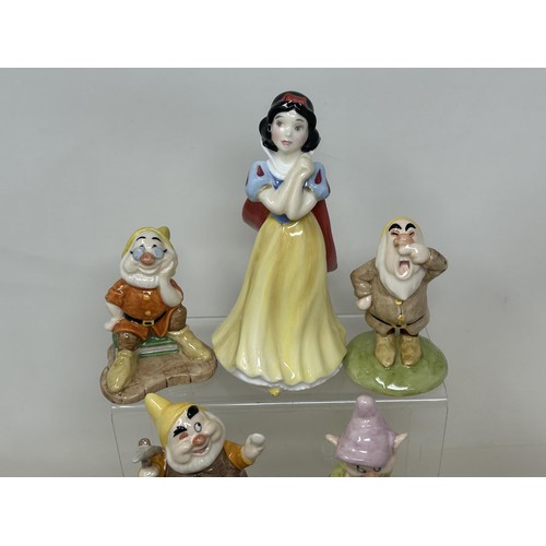 933 - A Royal Doulton set of Snow White and the Seven Dwarfs, No 1135, boxed with certificate, a Bunnykins... 