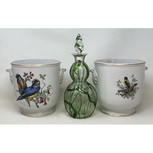 944 - A 20th century clear and green glass decanter, with a silver mount, and a pair of porcelain wine coo... 