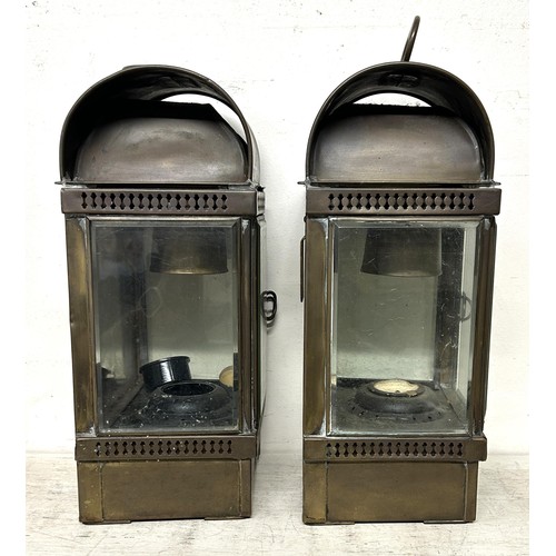 956 - A pair of lamps, by Eli Griffiths & Sons, 42 cm high