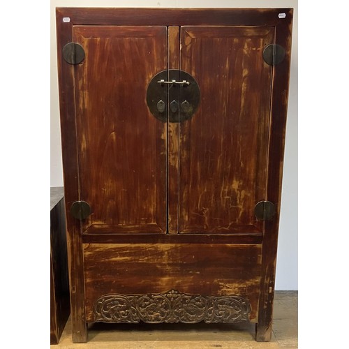 1173 - A Beijing cabinet, the top section having two cupboard doors, on a base with two further cupboard do... 