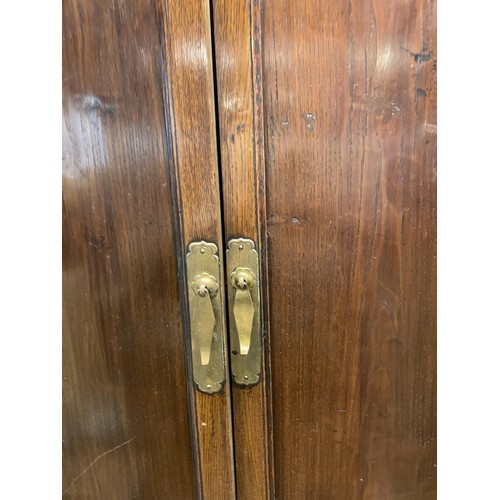 1170 - A Japanese elm and metal bound cabinet, having two cupboard doors above two further cupboard doors a... 