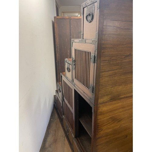 1167 - A Japanese step Tansu cabinet, 145 cm wide