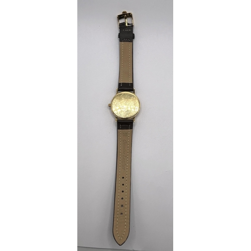 391 - A gentleman's 18ct gold Omega Seamaster Quartz wristwatch, on an associated leather strap