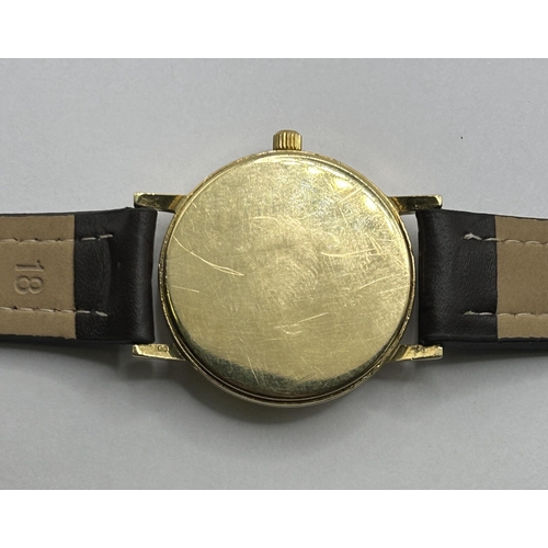 391 - A gentleman's 18ct gold Omega Seamaster Quartz wristwatch, on an associated leather strap