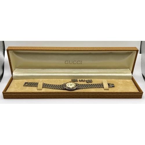 395 - A ladies stainless steel Gucci wristwatch, cased