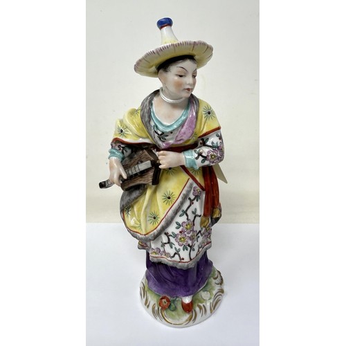 1034 - A pair of Dresden figures, of a man and a woman in Chinese dress, 20 cm high (2)