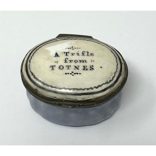 1033 - A George III enamel patch box, the lid reading A Trifle From Totnes, 2.4 cm wide