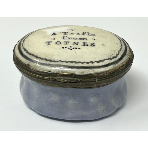 1033 - A George III enamel patch box, the lid reading A Trifle From Totnes, 2.4 cm wide