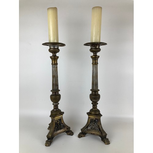 960 - A pair of brass pricket candlesticks, 62 cm high