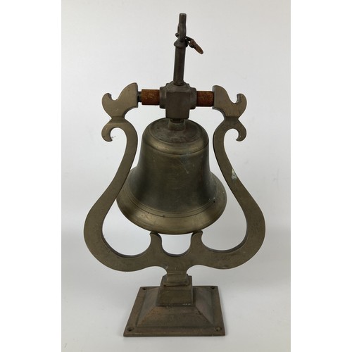 967 - An early 20th century copper wall mounted bell, with a wrought iron mount and ringer, bell diameter ... 