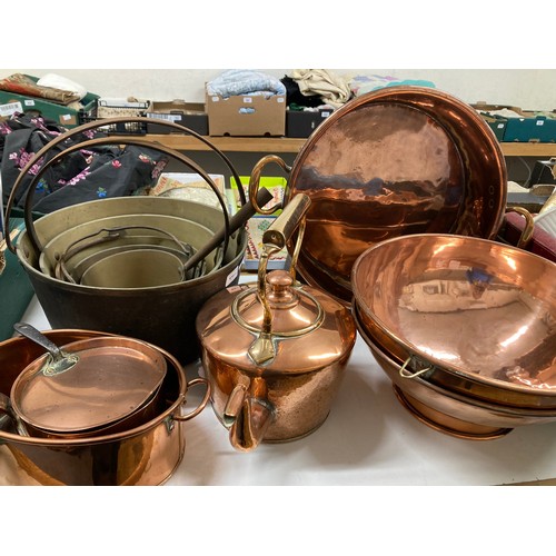 970 - A brass and copper preserve pan, assorted copper, and a set of graduated copper pans, with brass loo... 