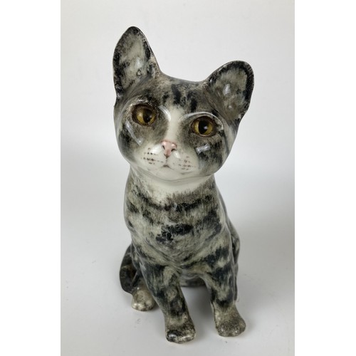 979 - A Winstanley cat, 23 cm high, and two other cat figures (3)