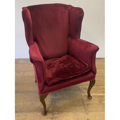 1120 - A pair of Parker Knoll type wingback armchairs, another, a mirror, a two tier trolley, a two tier ta... 