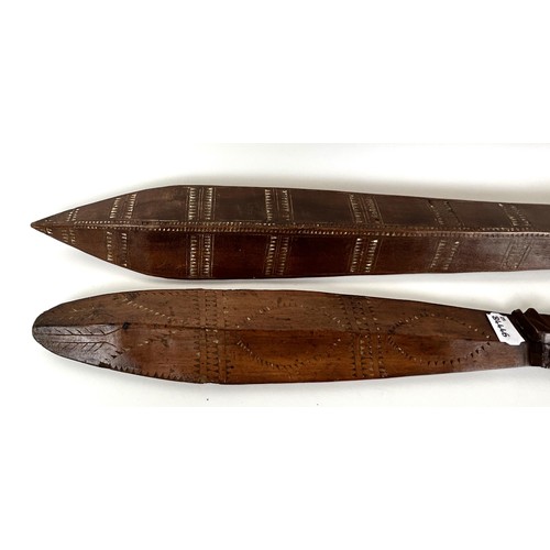 1070 - A carved Oceanic club, 107 cm, and another, 68 cm