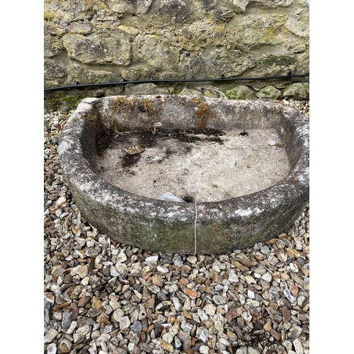 1211 - A demi lune stone trough, 95 cm wide