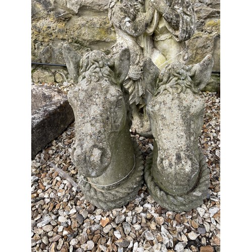 1210 - A pair of composite stone horses heads, 50 cm high