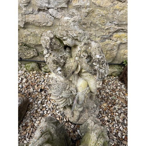 1209 - A composite stone garden statue, of a loving couple, 88 cm