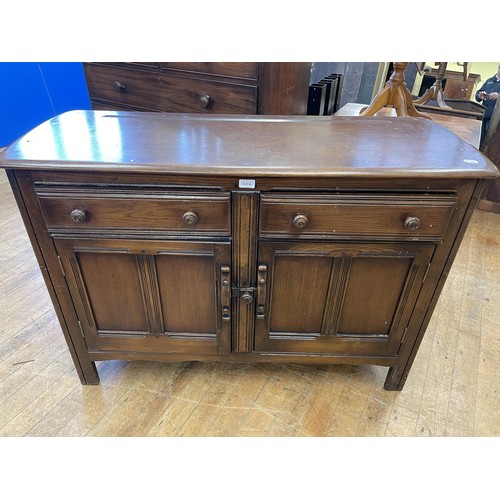 1202 - An oak coffee table, 60 cm wide, a pine drop leaf table, and a sideboard, 120 cm wide