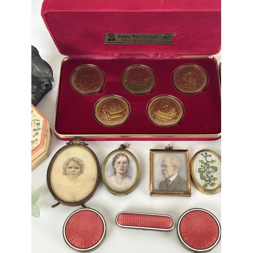 1040 - A gilt metal and enamel box, a set of coins and other items