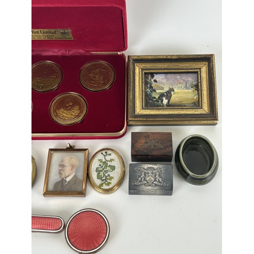 1040 - A gilt metal and enamel box, a set of coins and other items