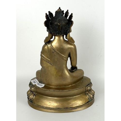 1100 - A gilt metal Buddha, 33 cm high