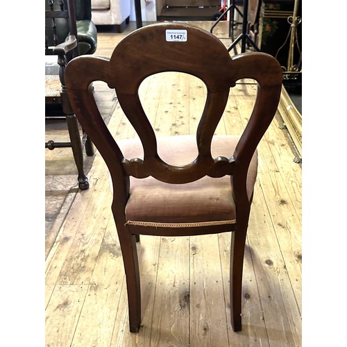 1147 - A set of four mahogany dining chairs, with padded seats (4)