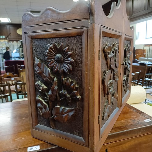 1141A - A walnut cupboard, decorated with carved flowers, 54 x 64 cm