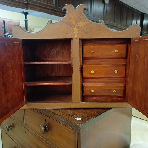 1141A - A walnut cupboard, decorated with carved flowers, 54 x 64 cm