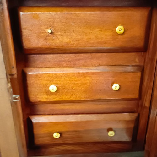 1141A - A walnut cupboard, decorated with carved flowers, 54 x 64 cm