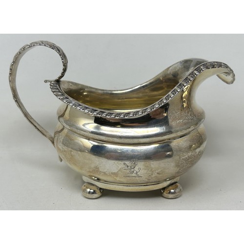 267A - An early 19th century silver three piece tea service, marks rubbed, 34.6 ozt (3)Ivory Exemption regi... 