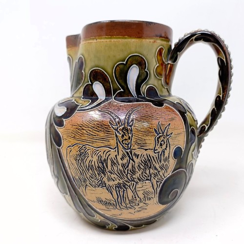 701 - A Doulton Lambeth jug, by Hannah Barlow, decorated goats, 17 cm high