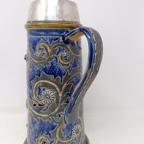 702 - A Doulton Lambeth jug, by George Tinworth, decorated floral motifs, with a silver mount, marks rubbe... 