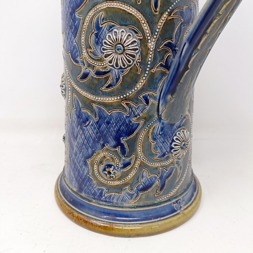 702 - A Doulton Lambeth jug, by George Tinworth, decorated floral motifs, with a silver mount, marks rubbe... 