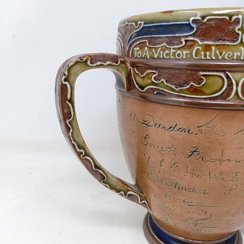 705 - A Royal Doulton three handled retirement loving cup, by Mark Marshall, with various signatures of th... 