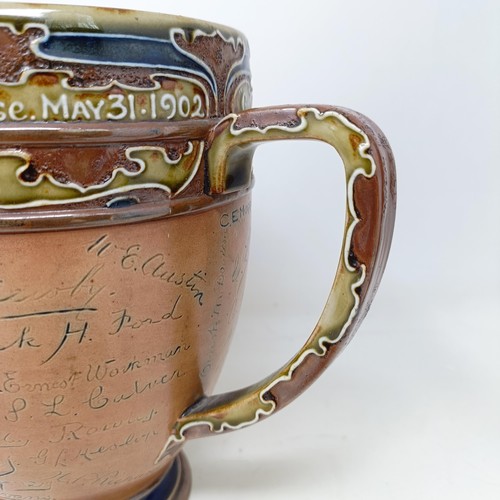 705 - A Royal Doulton three handled retirement loving cup, by Mark Marshall, with various signatures of th... 