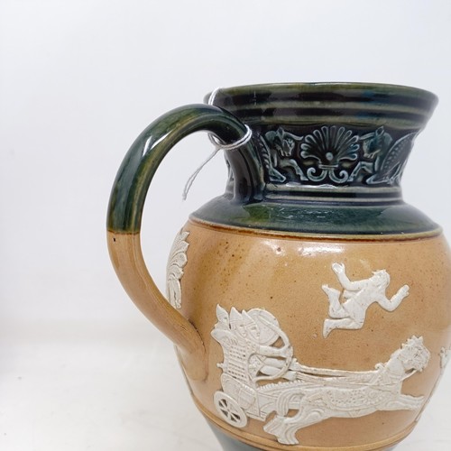 707 - A Doulton Lambeth jug, decorated in Egyptian manner, 20 cm