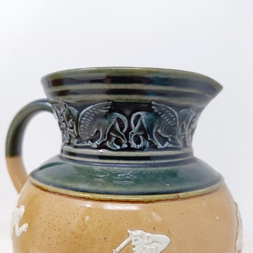 707 - A Doulton Lambeth jug, decorated in Egyptian manner, 20 cm