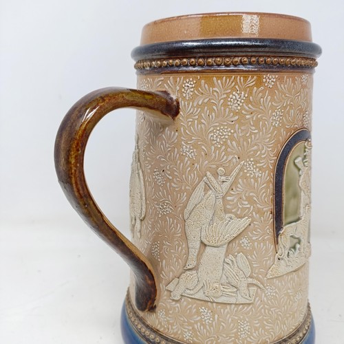 710 - A Doulton Lambeth jug, by Harriet Hibbut, decorated hunting scenes, 22 cm high