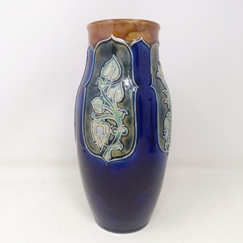 711 - A Royal Doulton vase, by Annie Neal and Eliza Stock, decorated flowers, 25 cm high