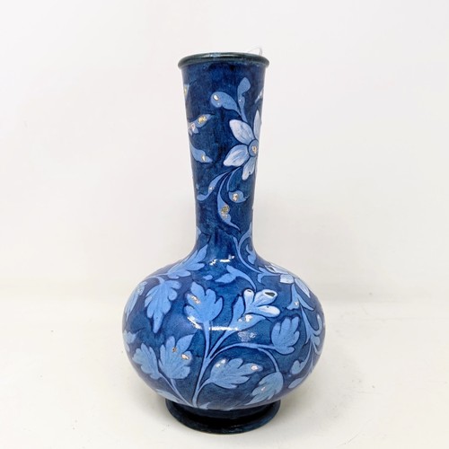 715 - A Doulton Faience vase, by Mina L Crawley, blue ground, decorated flowers, 21 cm high