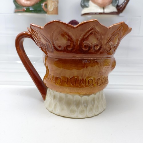 719 - A Royal Doulton character jug, Simon The Cellarer, Golfer D6623, Old King Cole, Izaak Walton, D6404,... 