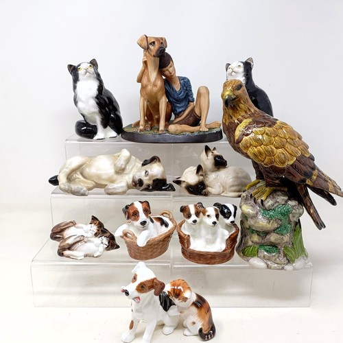 724 - A Royal Doulton figure of a Golden Eagle, RDA36, Buddies HN2546, a figure of a reclining dog, and as... 