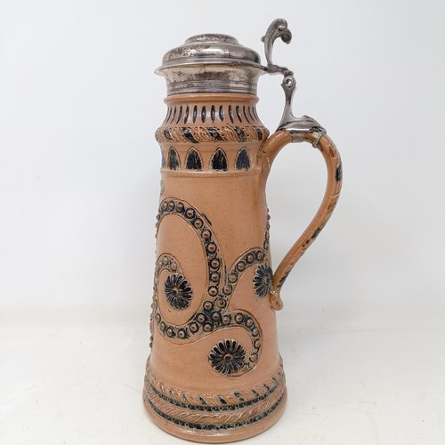 728 - A Doulton Lambeth stoneware flagon, with a silver mount, London 1866, 30 cm high