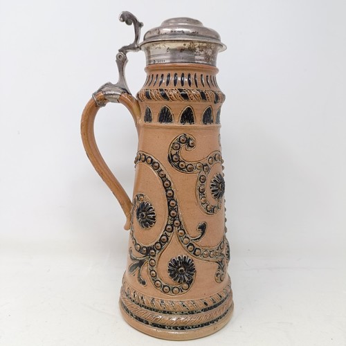 728 - A Doulton Lambeth stoneware flagon, with a silver mount, London 1866, 30 cm high