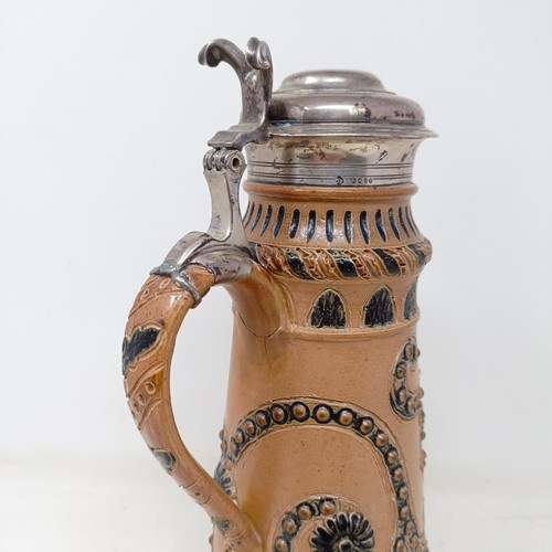 728 - A Doulton Lambeth stoneware flagon, with a silver mount, London 1866, 30 cm high